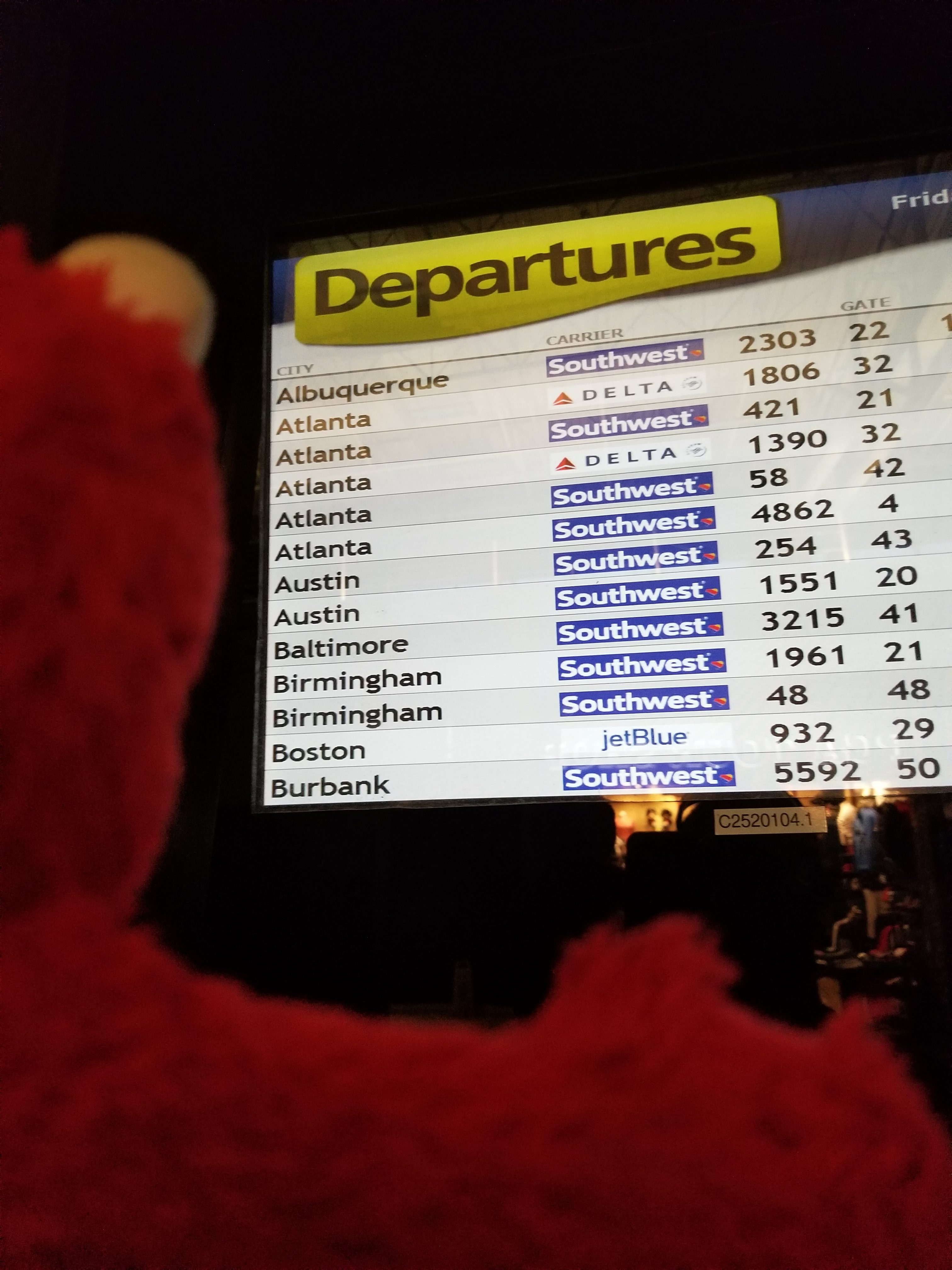 Elmo checks his flight status
