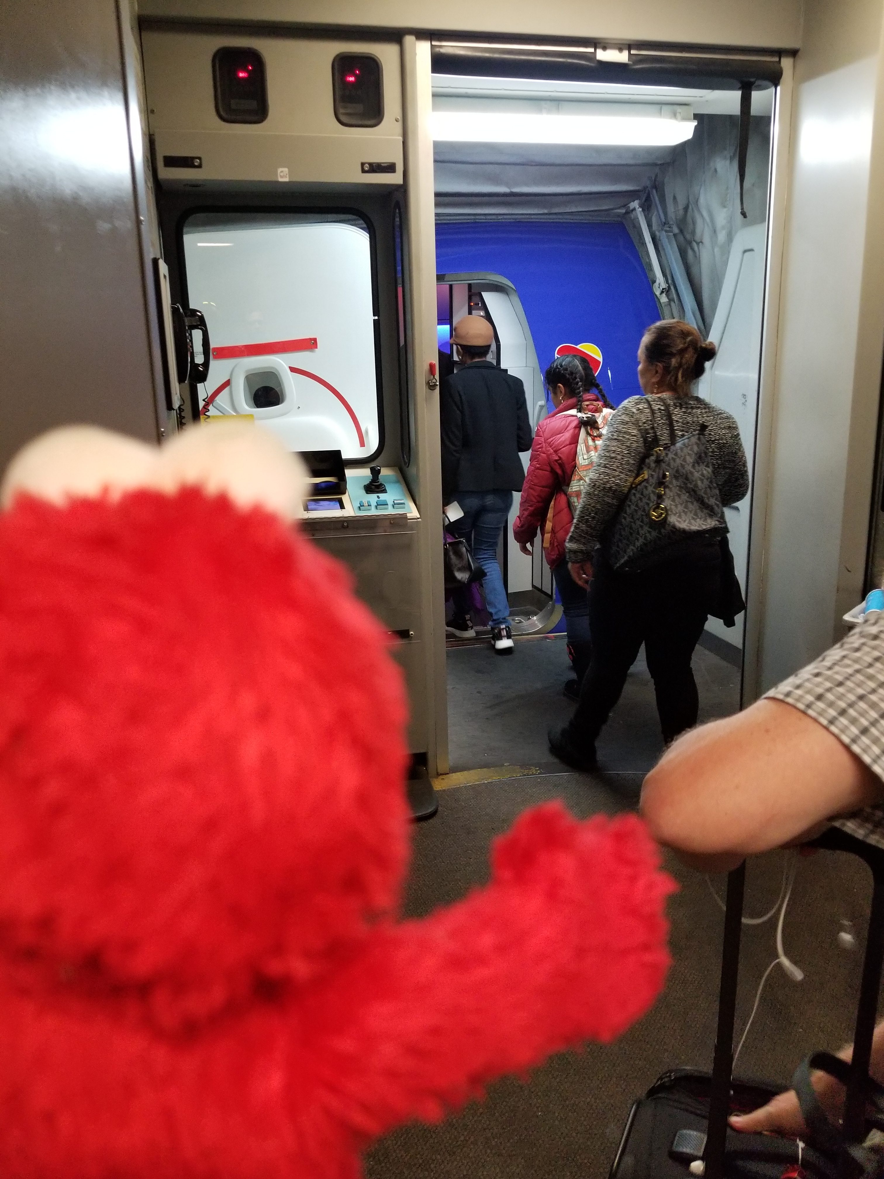 Elmo is excited, he can see the plane!
