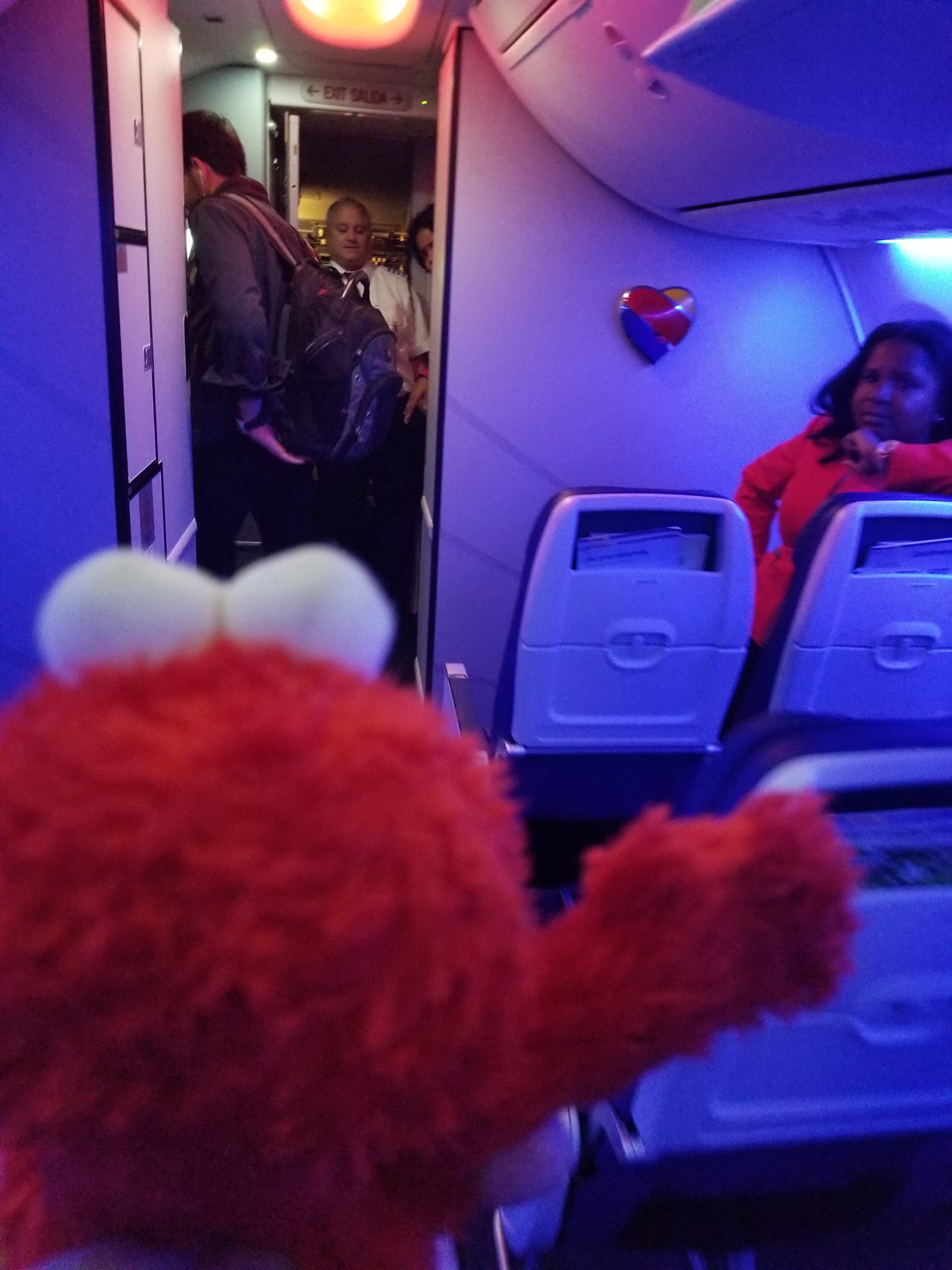Elmo waves to the crew and thanks them for another safe flight